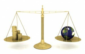 Scale with money on one side and a globe on the other