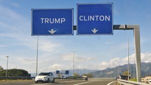Highway signs read "Trump" and "Clinton", but Trump's sign is on the left and Clinton's is on the right