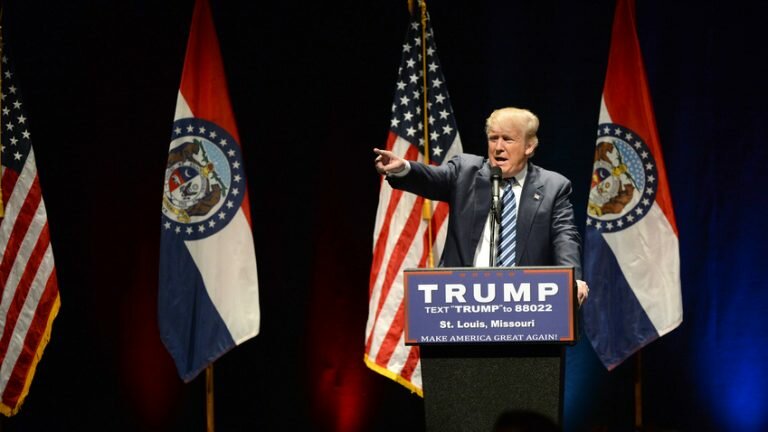 Donald Trump standing at a podium in St. Louis, Missouri