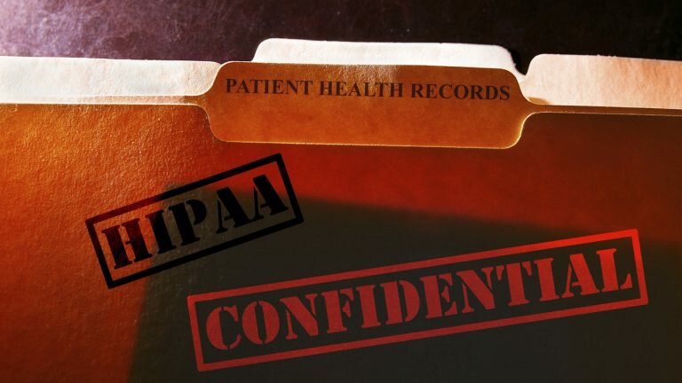 Folder reads "PATIENT HEALTH RECORDS" and is stamped "HIPAA" and "CONFIDENTIAL"